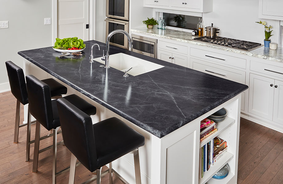 Kitchen with 3476-46 Jet Sequoia countertop island and chairs with 9284-43 Classic Crystal Granite perimeter countertops